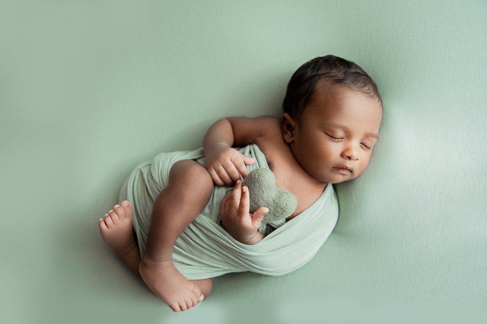 Egg wrapped newborn pose